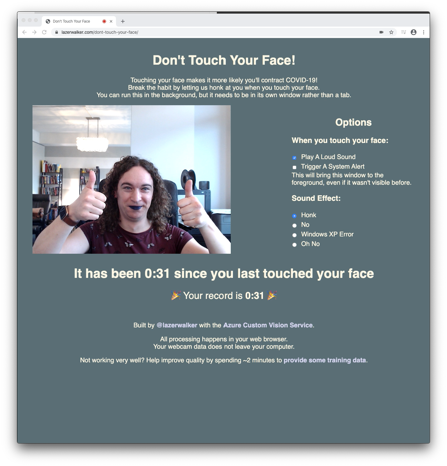 A screenshot of the web app while I am not touching my face in the webcam view. The website is a neutral color, and tells me it has been 31 seconds since I last touched my face